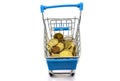 Many coins in a blue shopping trolley isolated on a white background. Close-up Royalty Free Stock Photo