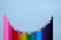 Many color pencils wave on grey background, flatlay. Back to school Royalty Free Stock Photo