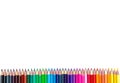 Many color pencils on white isolated background. close-up. view from above. stationery. space for text Royalty Free Stock Photo