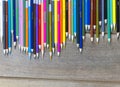 Many color pencils on wood table background with copy space for text or design Royalty Free Stock Photo