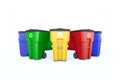 Many color plastic garbage bins with recycling logo.