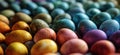 many colored eggs in rows