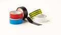 Many colored electrical tapes on a white background