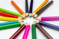 Many colored pencils arranged in a beautiful circle on a white background Royalty Free Stock Photo