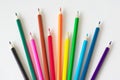 Many colored pencils lie on a white background. Copy spase. The concept of back to school, the educational process, study at Royalty Free Stock Photo