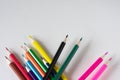 Many colored pencils lie on a white background. Copy spase. The concept of back to school, the educational process, study at Royalty Free Stock Photo