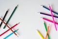 Many colored pencils lie on a white background. Copy spase. The concept of back to school, the educational process, study at Royalty Free Stock Photo