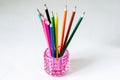 Many colored pencils lie on a white background. Copy spase. The concept of back to school, the educational process, study at Royalty Free Stock Photo