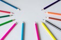 Many colored pencils lie on a white background. Copy spase. The concept of back to school, the educational process, study at Royalty Free Stock Photo