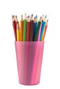 Many colored pencils in pink mug Royalty Free Stock Photo