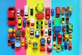 Many colored toy cars on multicolored background Royalty Free Stock Photo