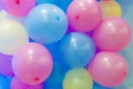 Many colorful balloons decorated wall as background. Royalty Free Stock Photo