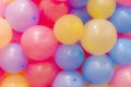 Many colorful balloons decorated wall as background. Royalty Free Stock Photo