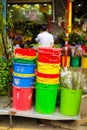 Many colorful big plastic buckets outdoor on flower street market in china