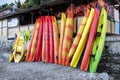 Many colorful boats, kayaks and canoes are moored at the boat station, used for summer boating and sports Royalty Free Stock Photo