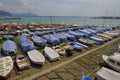 many colorful boats on the shore across the seaside view in Lavagna, Liguria, Italy. Coast view Royalty Free Stock Photo