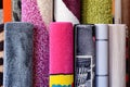 Many colorful carpets in the store. Carpet Rolls Shop Colourful Fabric decoration Royalty Free Stock Photo