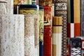 Many colorful carpets in the store. Carpet Rolls Shop Colourful Fabric decoration Royalty Free Stock Photo