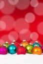 Many colorful Christmas balls background decoration with snow Royalty Free Stock Photo