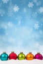 Many colorful Christmas balls baubles background decoration portrait format snowflakes snow copyspace Royalty Free Stock Photo