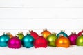 Many colorful Christmas balls wood wooden background decoration Royalty Free Stock Photo