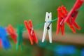 Many colorful clothespines on the rope Royalty Free Stock Photo