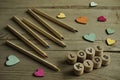 Many colorful crayons, pencils, colorful wooden ornaments heart hapes, sign Love kids