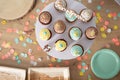 Many colorful cupcake muffins served on a plate