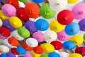 Many colorful decorative umbrellas hanging from a ceiling