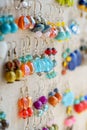 Many colorful earrings for sale at market