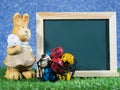 Many colorful of Easter eggs placed in front of blackboard with Easter rabbit. Blackboard with colorful of Easter eggs and Easter Royalty Free Stock Photo