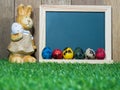 Many colorful of Easter eggs placed in front of blackboard with Easter rabbit. Blackboard with colorful of Easter eggs and Easter Royalty Free Stock Photo