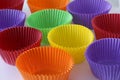 Many colorful empty paper forms capsules for muffins and cupcakes on white background - baking dessert - close up on white Royalty Free Stock Photo