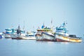 Many Colorful fishing boats floating in the ocean in Paracas Peru Royalty Free Stock Photo