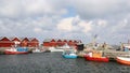 Many colorful fishing boats and houses in Hasle harbor on Bornholm. Royalty Free Stock Photo
