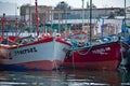 Many Colorful fishing boats lined up floating closeup in the ocean in Paracas Peru Royalty Free Stock Photo