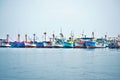 Many Colorful fishing boats lined up floating in the ocean in Paracas Peru Royalty Free Stock Photo