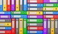 Many colorful folders stacked in a row. Royalty Free Stock Photo