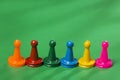 Many colorful game pieces, plastic figures Royalty Free Stock Photo