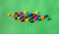 Many colorful game pieces, plastic figures Royalty Free Stock Photo