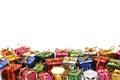 Many colorful gift boxes with gold ribbons on white background. Royalty Free Stock Photo