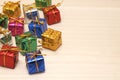 Many colorful gift boxes with gold ribbons.