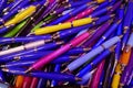 Many colorful, glossy ballpoint pens