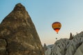 Many colorful hot air balloons flight above mountains - panorama of Cappadocia at sunrise. Wide landscape of Goreme valley Royalty Free Stock Photo