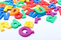 Many colorful magnetic letters on white, closeup Royalty Free Stock Photo