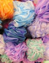 Many colorful nylon mesh scrubber sponges