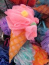 Colorful nylon mesh ice cream cone exfoliating sponges.