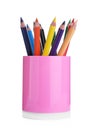 Many colorful pencils in pink holder isolated. School stationery Royalty Free Stock Photo