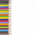 Many colorful pencils in a vertical row Royalty Free Stock Photo