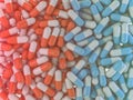 Many colorful pills abstract background. 3D